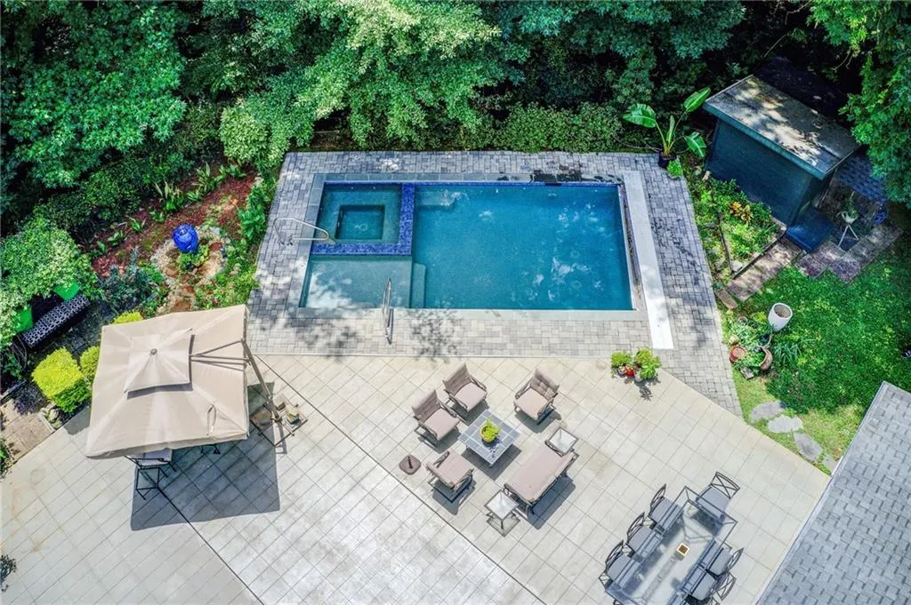 View of swimming pool with a patio area