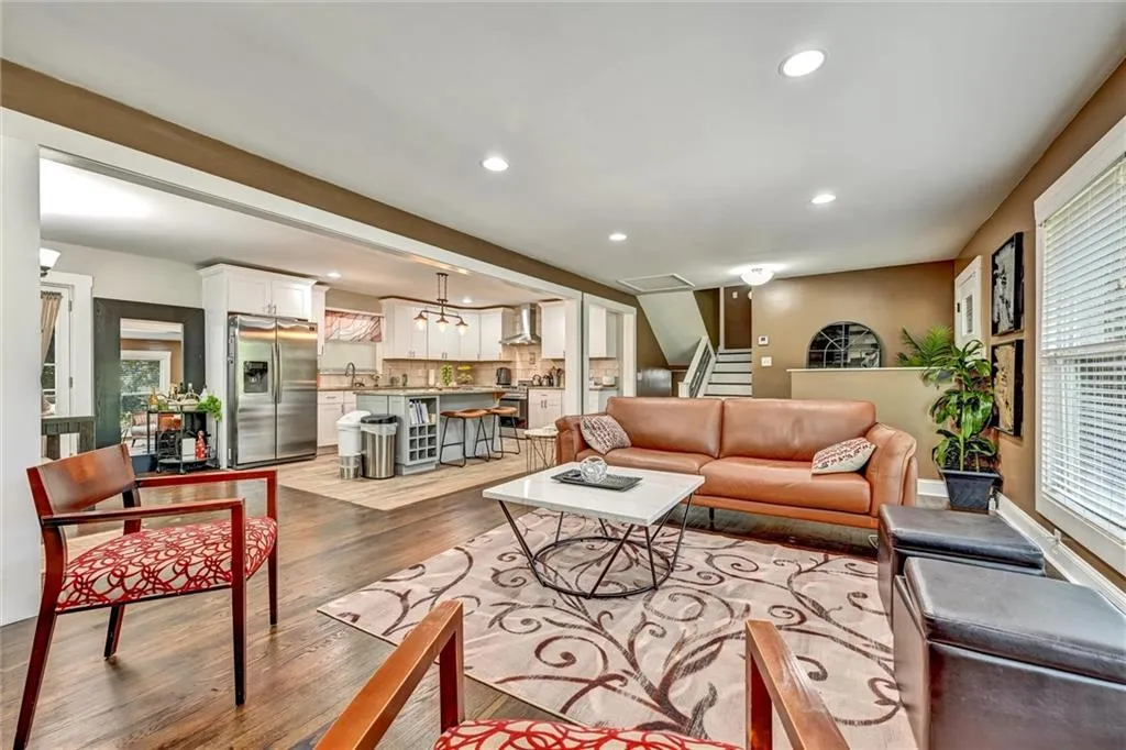 Living room with light hardwood / wood-style flooring