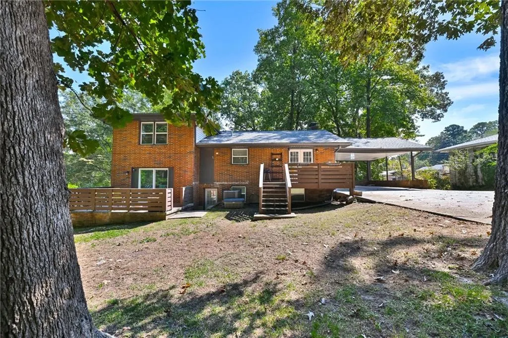 Rear view of house featuring a patio