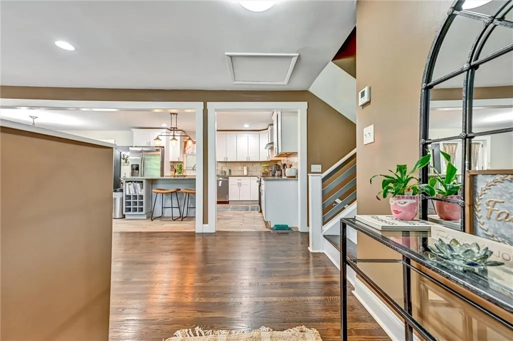 Foyer with dark hardwood / wood-style floors