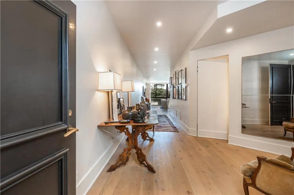 Corridor featuring light wood-type flooring, recessed lighting, and an office area