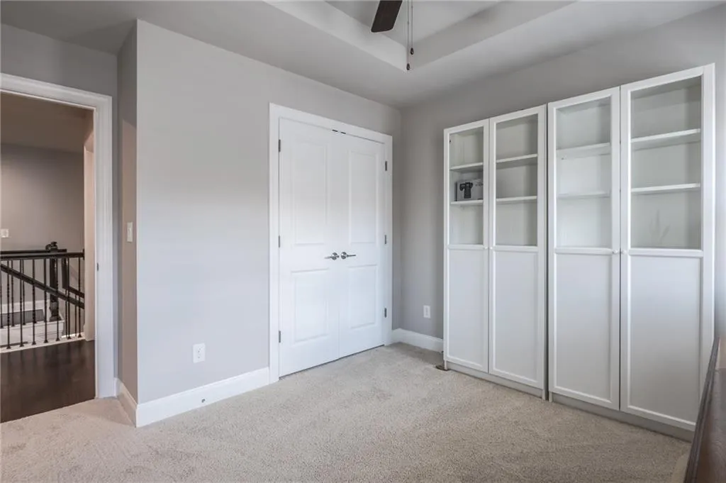 Unfurnished bedroom with carpet floors