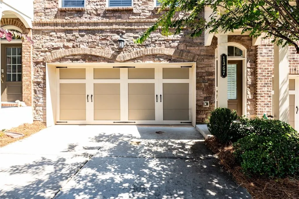Garage featuring driveway