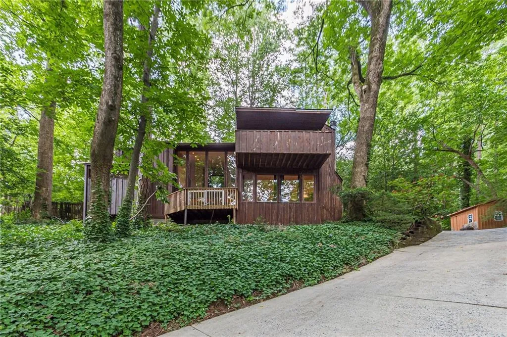 Rear view of property featuring a deck