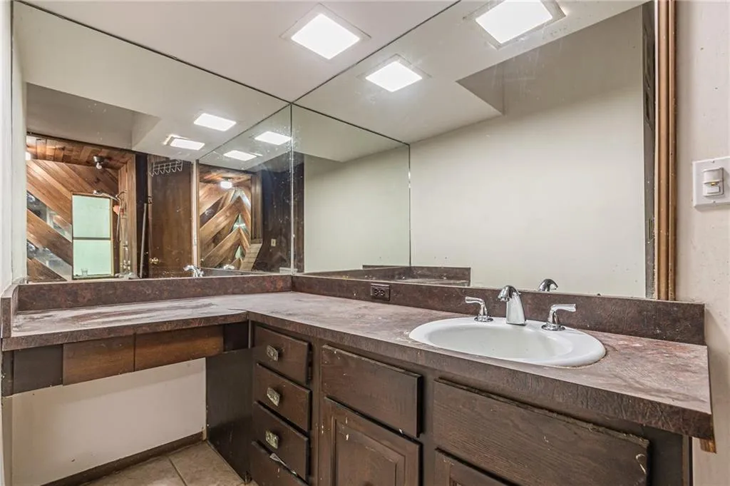 Bathroom with vanity and tile patterned flooring