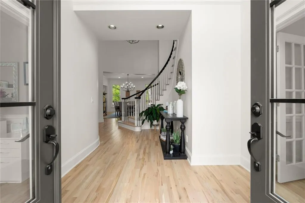 Foyer entrance featuring hardwood floors throughout
