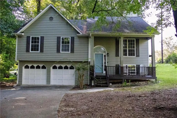 Two-car garage with white paneled doors