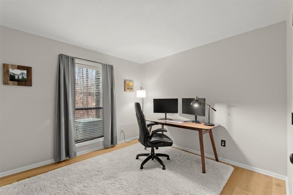 secondary bedroom with hardwood flooring