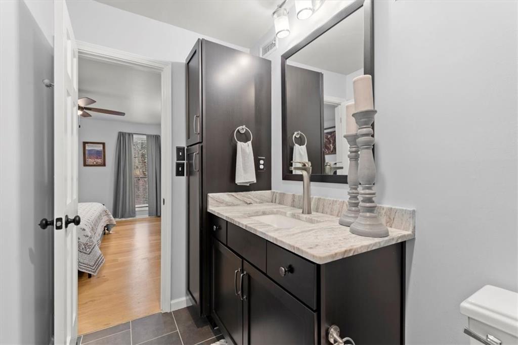 Primary bathroom with honed granite counter tops.