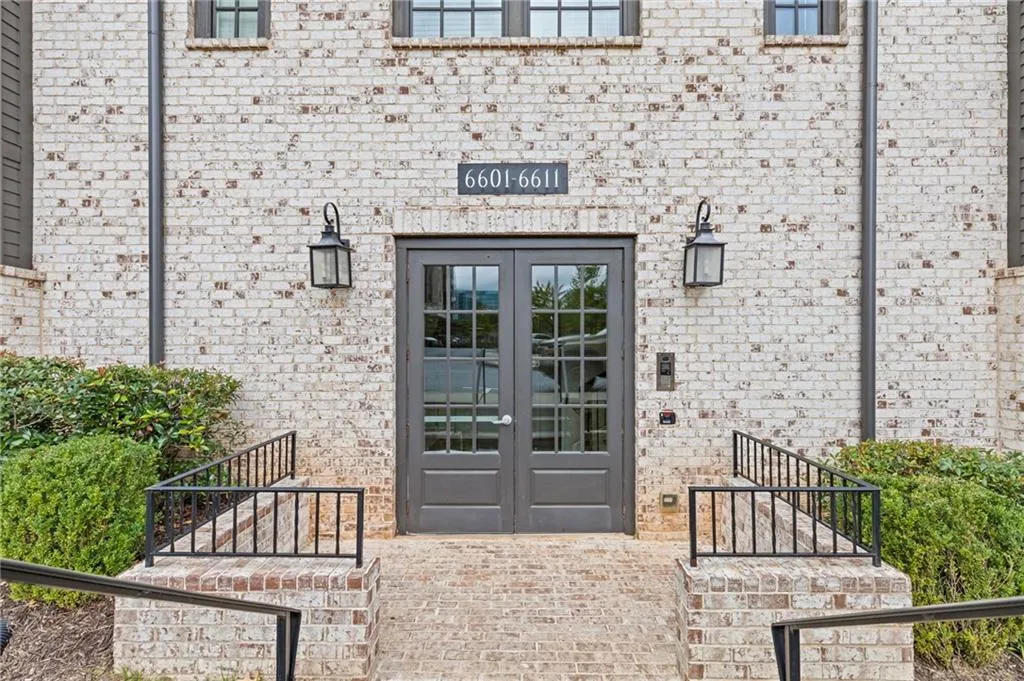 Entrance to property with french doors and brick siding