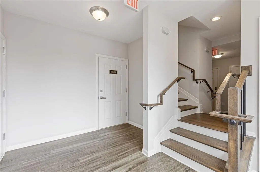 Foyer entrance featuring light wood-style flooring and stairs