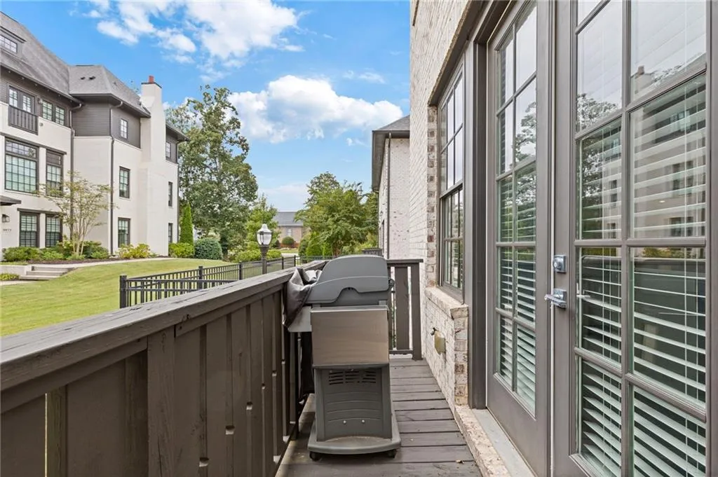 Balcony with area for grilling and a residential view