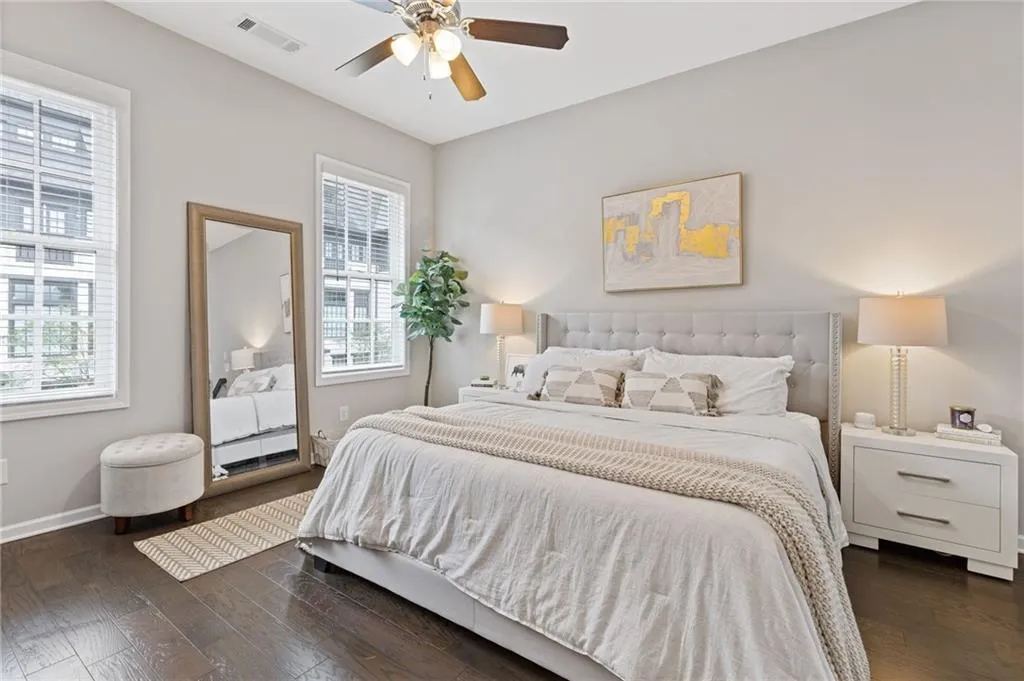 Bedroom featuring dark wood-style flooring and a ceiling fan