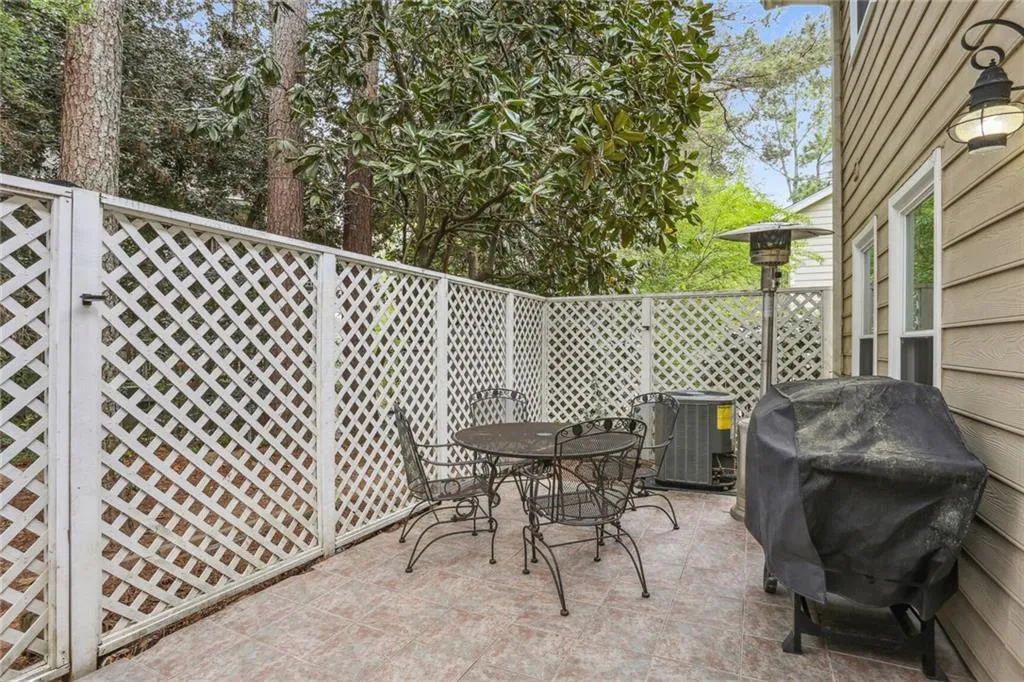 View of patio / terrace featuring a grill and central AC unit View of patio / terrace featuring a grill and central AC unit