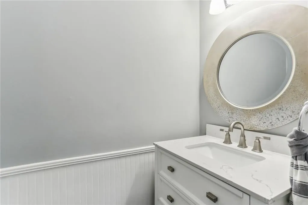 Half bathroom featuring oversized vanity Half bathroom featuring oversized vanity