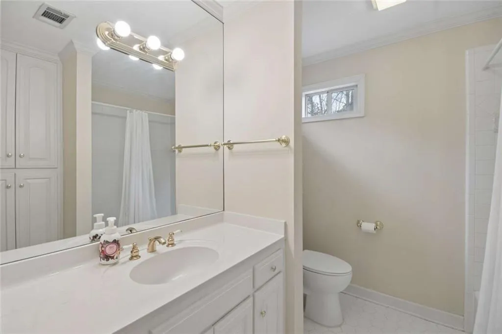 One of three upstairs en suite bathrooms.
