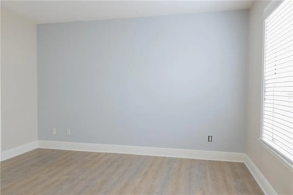 Empty room featuring light wood-type flooring
