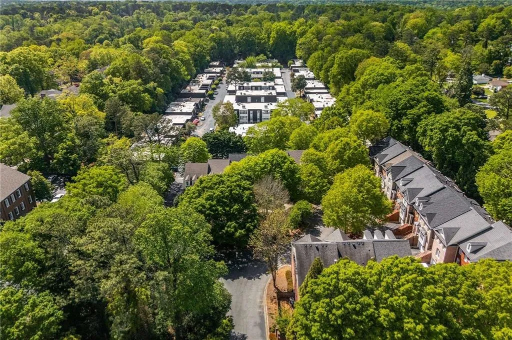 Bird's eye view with a wooded view and a residential view
