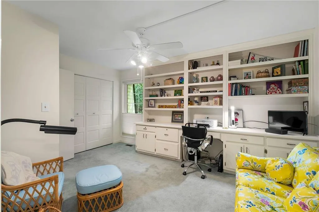 Filled with built in shelving, this room could  serve as a wonderful office.
