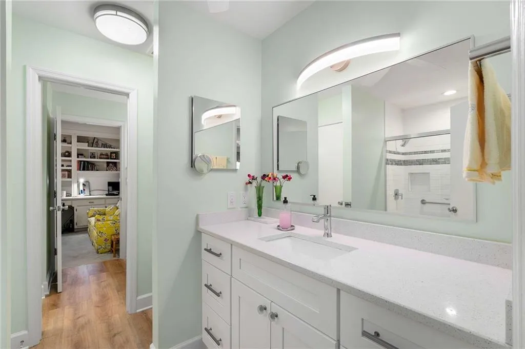 Updated primary bath is lovely with marble counters.