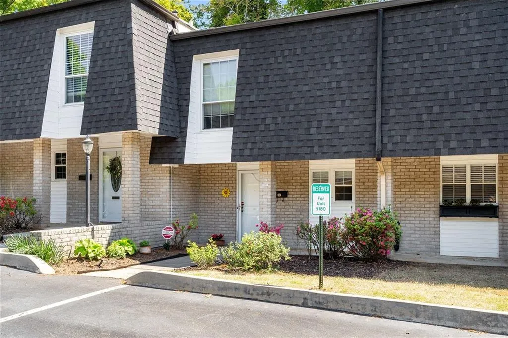Welcome home!  Residents here can plant flowers and shrubs in front of their units for a welcoming entry way.