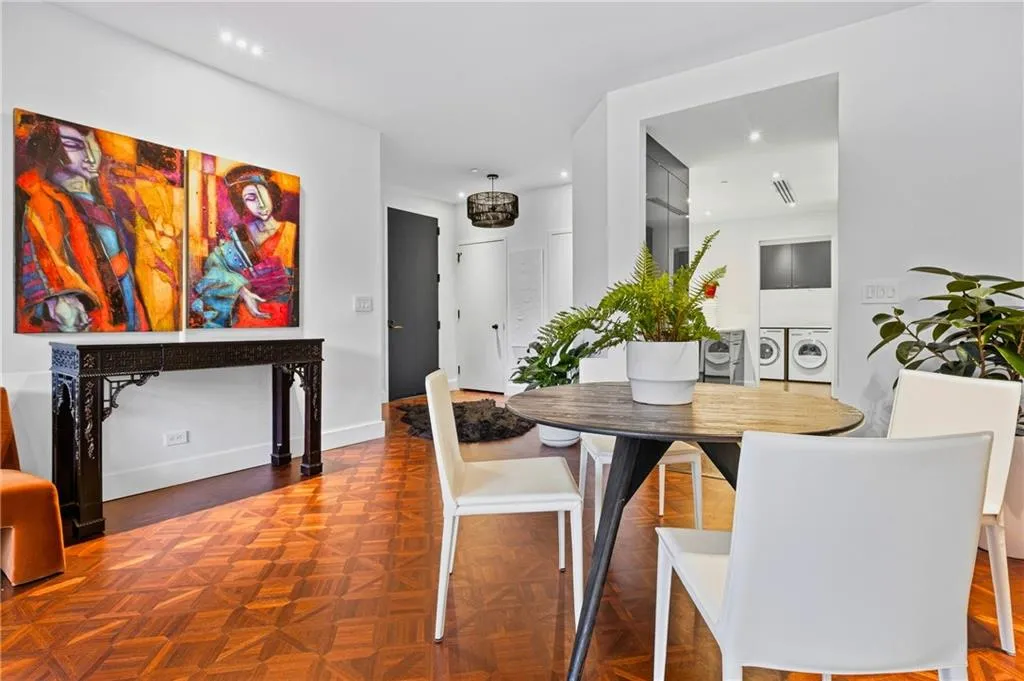 Parquet wood-finish flooring, recessed lighting, and a contemporary ceiling fixture
