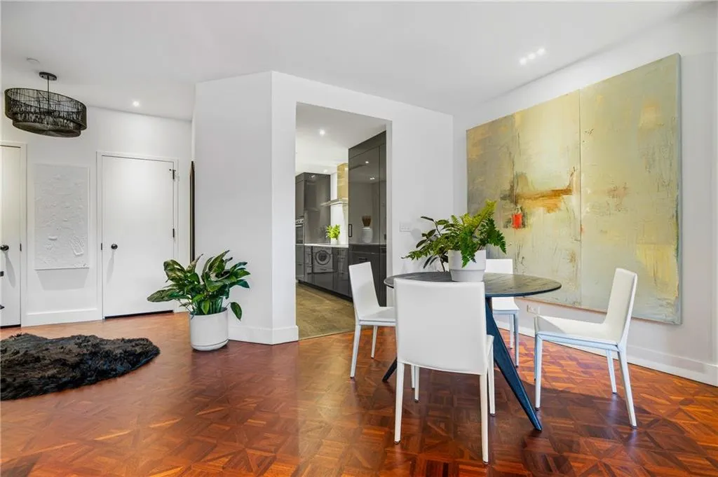 Parquet wood-finish flooring, recessed lighting, and a modern ceiling light fixture