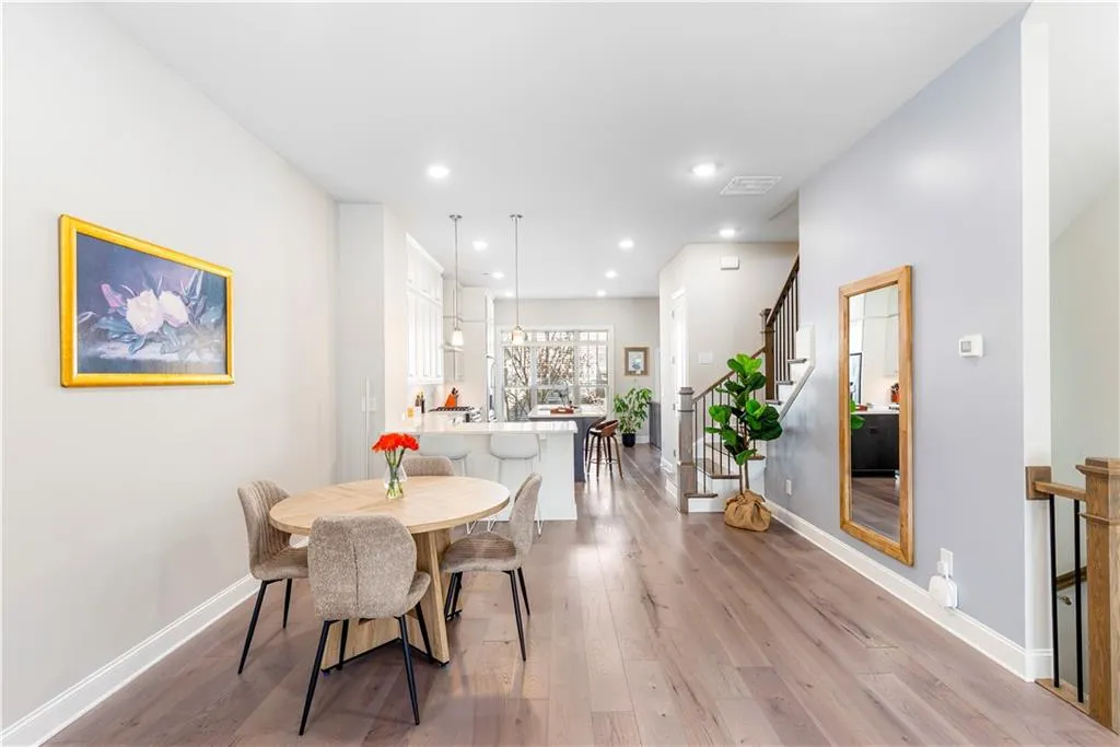 Dining area featuring stairs, recessed lighting, and light wood-style floors