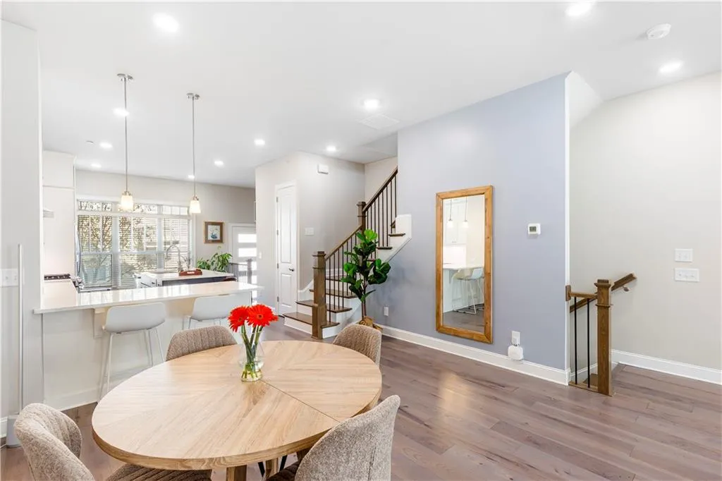 Dining room with stairs, recessed lighting, and light wood-style flooring