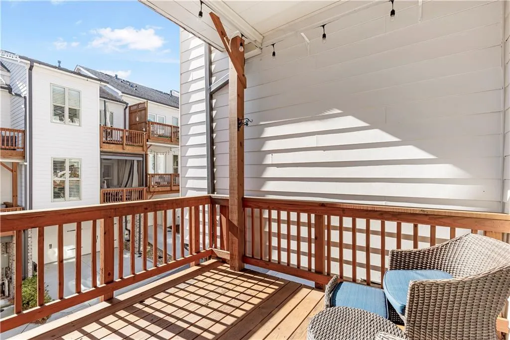 Wooden terrace featuring a residential view