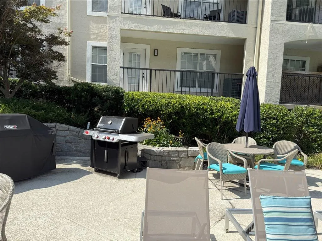 View of patio / terrace with grilling area and outdoor dining space