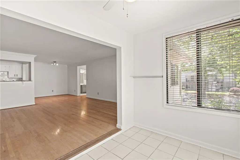Empty room featuring light hardwood / wood-style flooring and ceiling fan