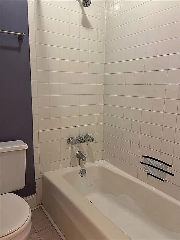 Additional View of the full bathroom with shower /tub combination and tile patterned floors