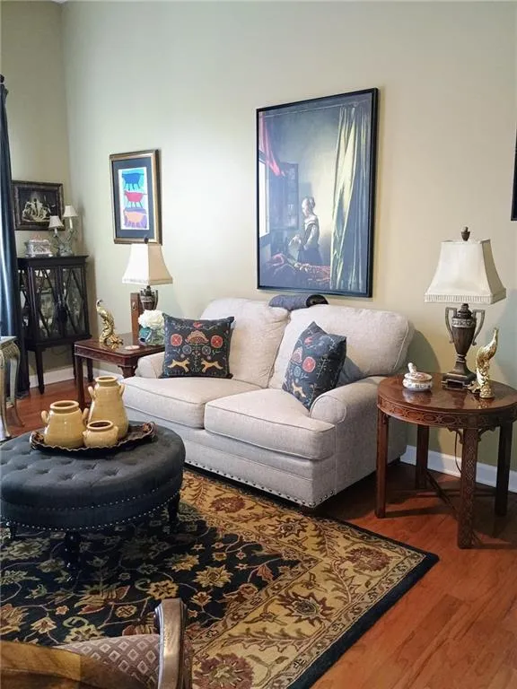 Living room with wood finished floors and baseboards