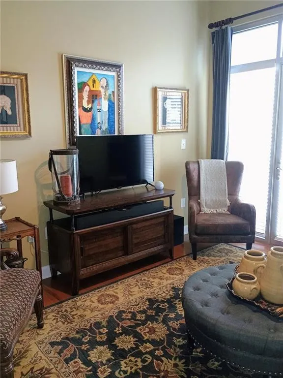 Sitting room with wood finished floors and baseboards