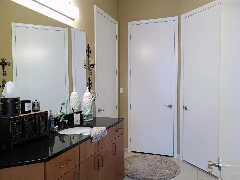Bathroom with tile patterned flooring and vanity