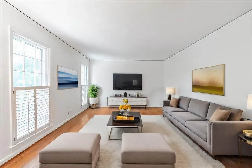 Living room with tons of natural light. Virtually staged.