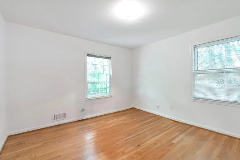 Unfurnished room with light wood-type flooring