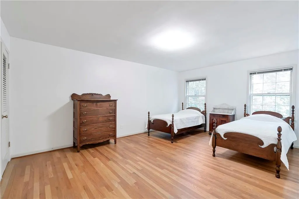 Bedroom with a closet and light wood-type flooring