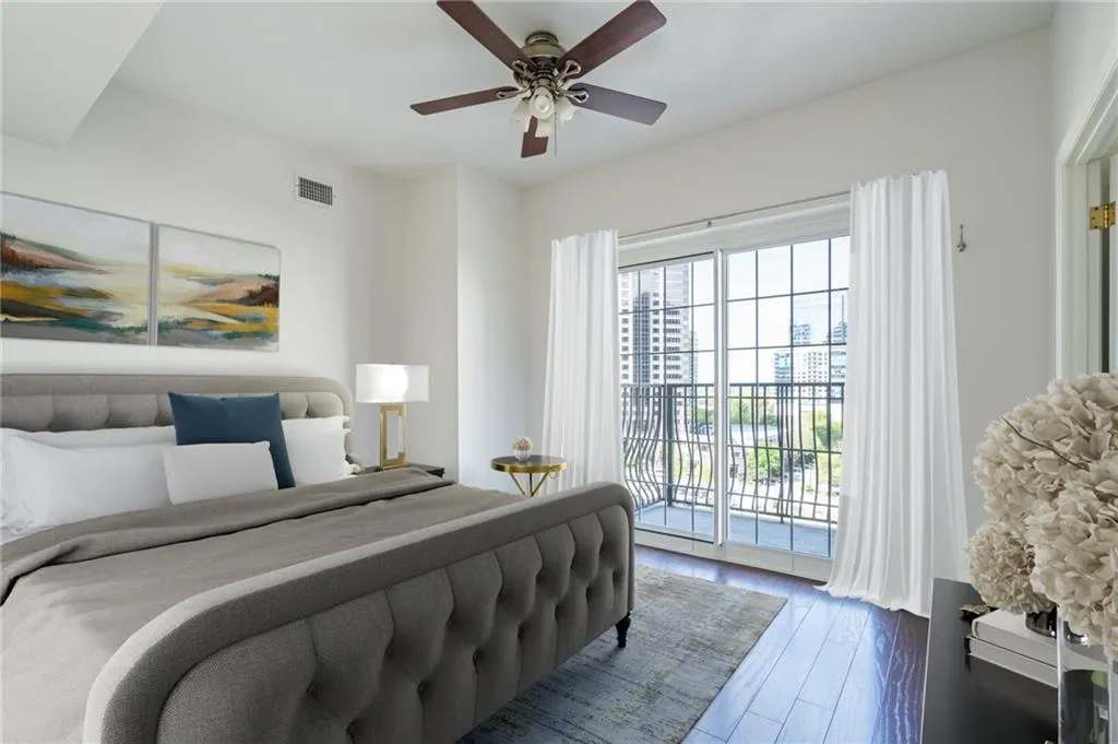 Bedroom featuring rich wood-finish flooring and a ceiling fan