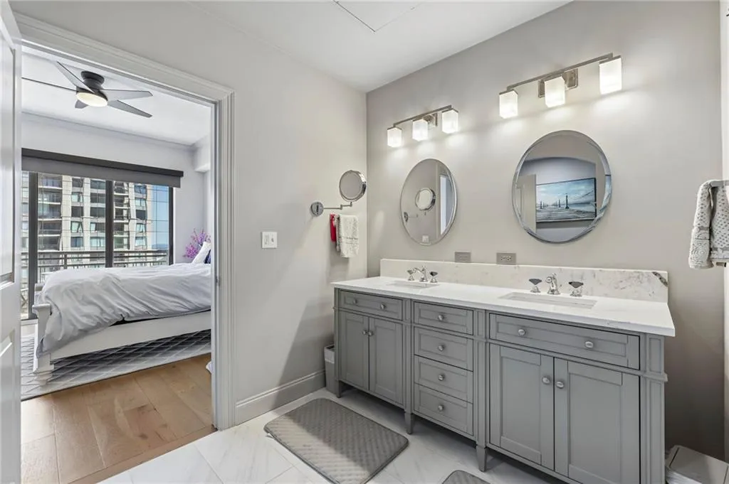 Fully renovated primary bath with double vanity.