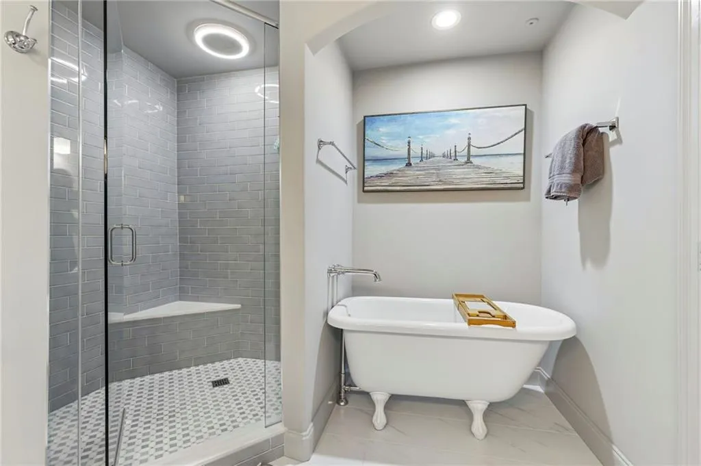 Separate soaking tub and large shower.