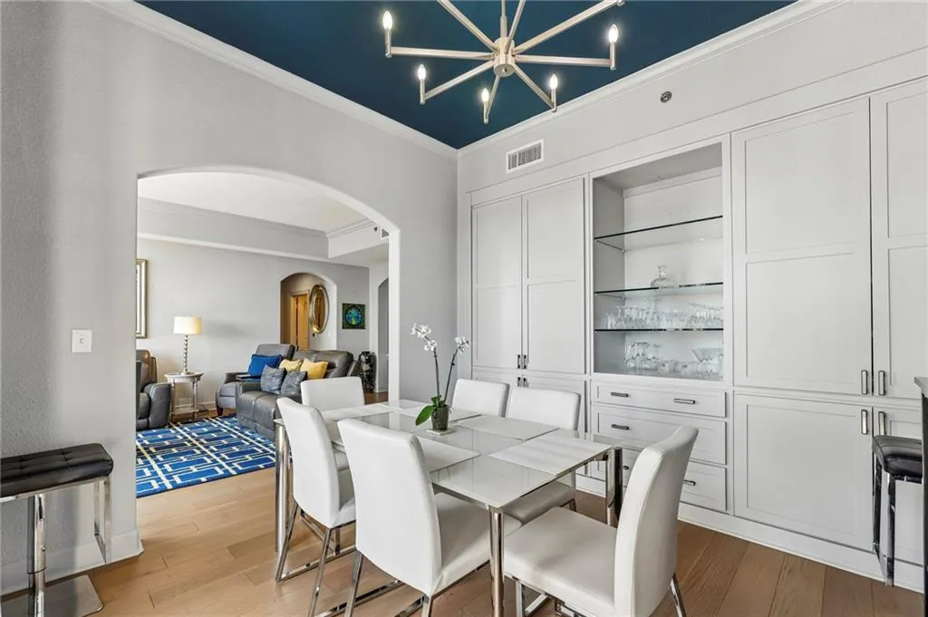 Gorgeous custom built in cabinet in dining room for extra storage.