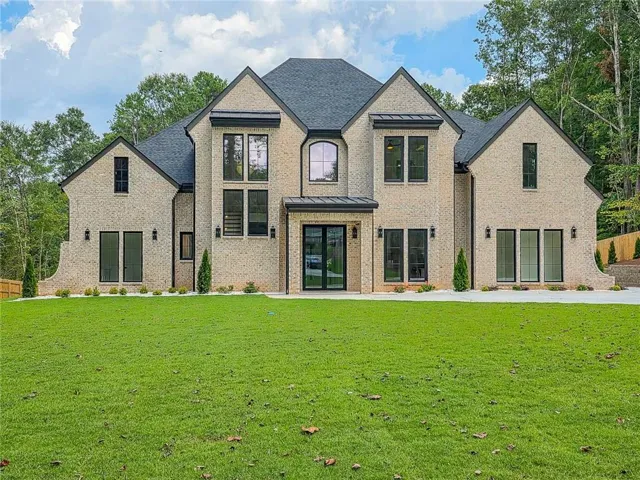 Light-toned brick exterior with dark-framed windows