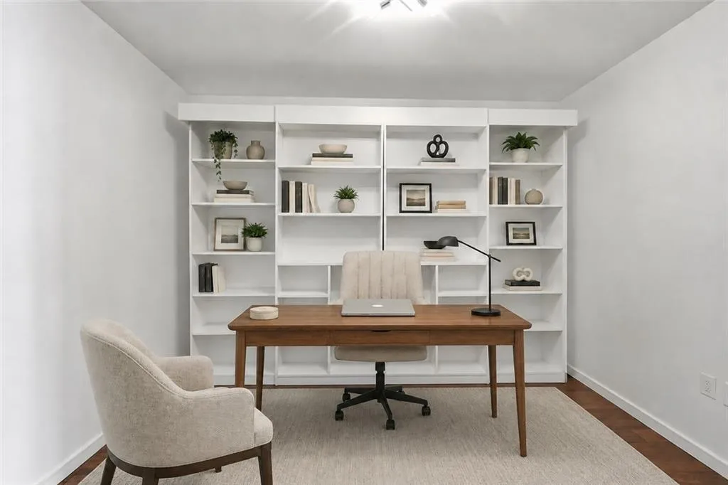 VIRTUALLY STAGED-Integrated white wall-to-wall shelving, wood-finish flooring, and recessed ceiling lighting