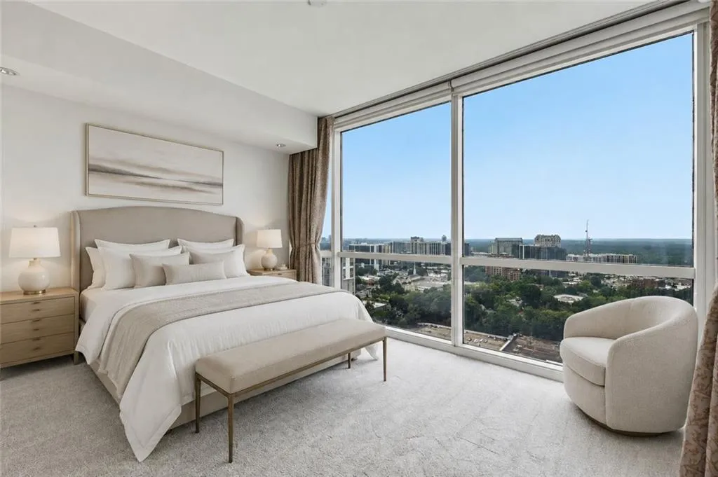 VIRTUALLY STAGED-Floor-to-ceiling windows, cityscape scenery, recessed lighting, and a neutral color palette