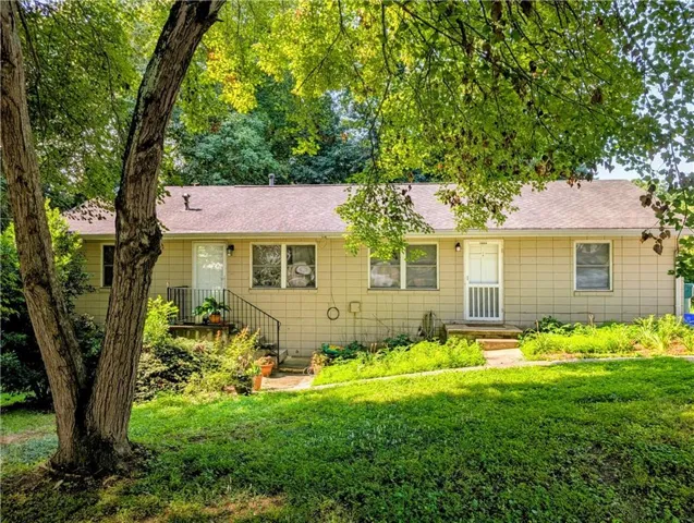 Charming single-story duples set beneath mature shade trees on a lush, landscaped lot
