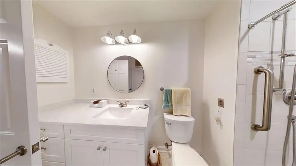 Bathroom with vanity and a walk in shower
