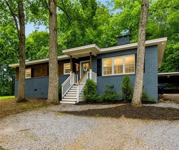 Brick and wood shingle exterior with a covered entry