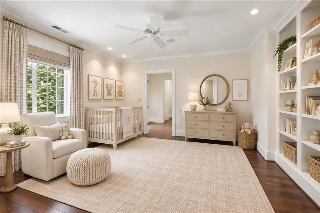 Virtually staged as a nursery area within the Primary Suite
